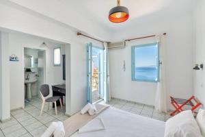 A bed or beds in a room at APOLLON PALACE
