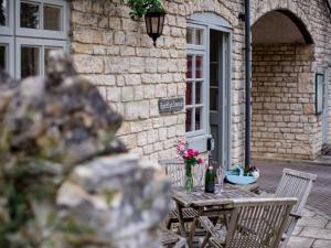 a table and chairs in front of a building at Lord High Admiral in Winchcombe