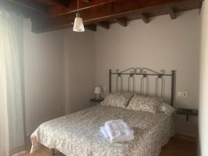Un pat sau paturi într-o cameră la Albergue Ponte Olveira