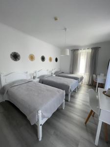 Katil atau katil-katil dalam bilik di Casa de Hospedes D. Maria Parreirinha
