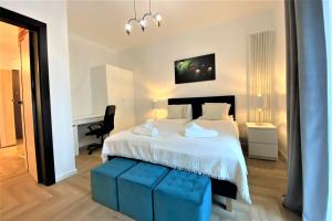Posteľ alebo postele v izbe v ubytovaní erApartments Mennica Residence