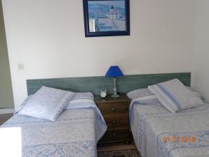 Katil atau katil-katil dalam bilik di Duplex en Hendaye