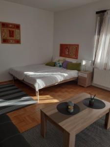 Postel nebo postele na pokoji v ubytování Aroma Apartman