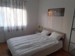 Postel nebo postele na pokoji v ubytování Aroma Apartman