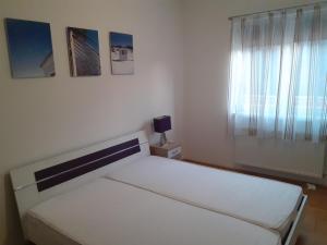 Postel nebo postele na pokoji v ubytování Aroma Apartman