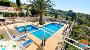 Bazén v ubytovaní Villa Delfin, 3 tolle Apartements für je 4 bis 6 Personen - in L Alfàs del Pi alebo v jeho blízkosti