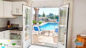 Bazén v ubytovaní Villa Delfin, 3 tolle Apartements für je 4 bis 6 Personen - in L Alfàs del Pi alebo v jeho blízkosti