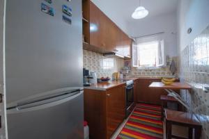 A kitchen or kitchenette at Sunny Apartment in Kanoni