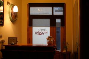 a room with a window with a sign on it at Pensi&oacute;n Arg&uuml;elles in Ribadesella