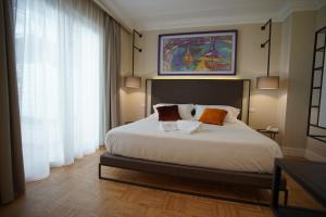 A bed or beds in a room at Palazzo Bibbi - Rooms to Live
