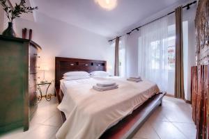 Postel nebo postele na pokoji v ubytování B&B Villa Vis