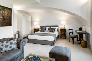 Säng eller sängar i ett rum på Palazzo Ducale Venturi - Luxury Hotel & Wellness