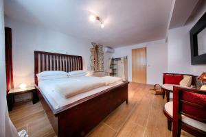 Postel nebo postele na pokoji v ubytování B&B Villa Vis