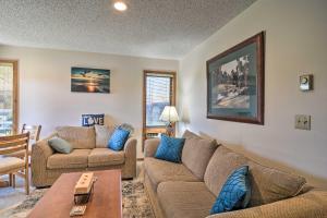 A seating area at Sunny Mountain Condo with Grill, Walk to Golf and Ski!