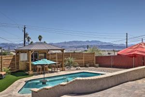 a swimming pool in a yard with a gazebo at Updated Home with Outdoor Oasis, 2 Mi to Lake! in Lake Havasu City