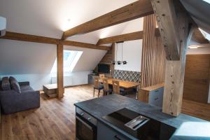 a kitchen and dining room with wooden beams at Hochhubergut in Aschach an der Steyr