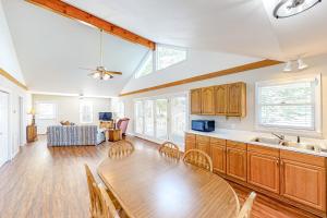 a kitchen and dining room with a table and chairs at Serenity at the Lake in Lake Murray Shores