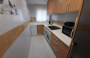 A kitchen or kitchenette at Apartamento Calpe - La Fossa - Peñon Ifach