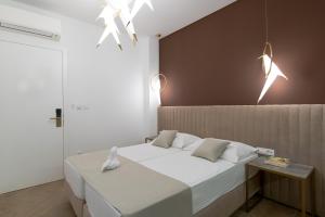Ein Bett oder Betten in einem Zimmer der Unterkunft Bošket Luxury Rooms