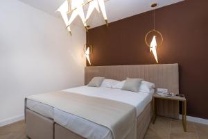 Ein Bett oder Betten in einem Zimmer der Unterkunft Bošket Luxury Rooms