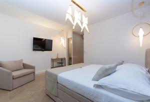 Ein Bett oder Betten in einem Zimmer der Unterkunft Bošket Luxury Rooms