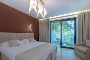 Ein Bett oder Betten in einem Zimmer der Unterkunft Bošket Luxury Rooms