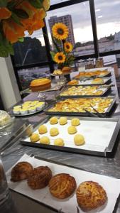 a buffet of cookies and pastries on a table at Hotel Universal in Santarém