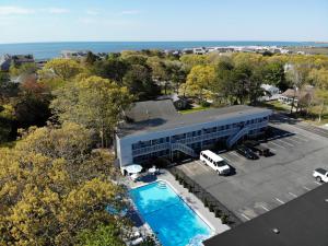 an aerial view of a building with a pool at Ocean Breeze Motel in South Yarmouth