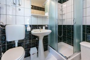 Kúpeľňa v ubytovaní Apartmani Tena