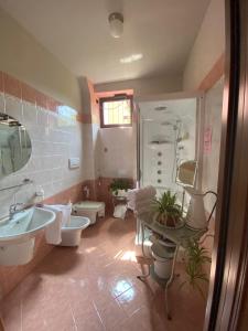 a bathroom with a sink and a toilet and a shower at The Tower Of The Old King in Desenzano del Garda