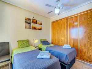 Postel nebo postele na pokoji v ubytování Casa vacanze a Orihuela con giardino