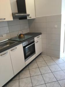 Kuchyň nebo kuchyňský kout v ubytování Amelia Apartment + 56 fotografií