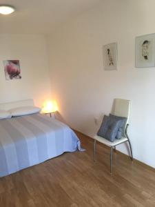 Postel nebo postele na pokoji v ubytování Amelia Apartment