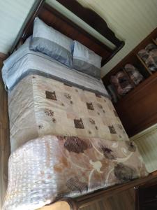 Säng eller sängar i ett rum på Casa Campos do Jordão