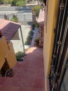 a brick walkway next to a house with a building at Maria's Place, Puerto Peñasco, Oriente in Puerto Peñasco