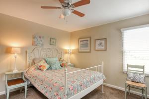 a bedroom with a bed and a ceiling fan at 432 Saratoga in Grover Beach