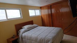 Postel nebo postele na pokoji v ubytování Alberca climatizada, con departamento para grupos!!