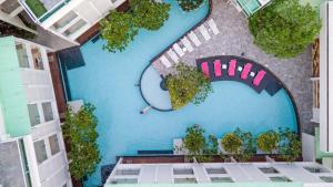 an overhead view of a swimming pool in a building at The Sea Cret Hua Hin in Hua Hin