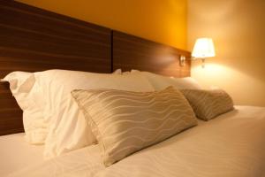 Letto o letti in una camera di Pine Tree Hotel