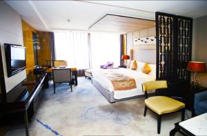 Postel nebo postele na pokoji v ubytování Tangla Hotel Tianjin