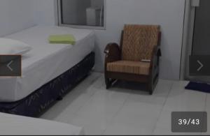 Postel nebo postele na pokoji v ubytování Benara Shariah Homestay