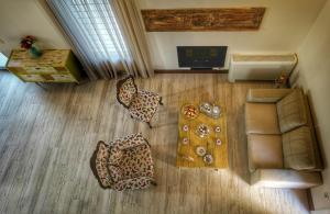 an overhead view of a living room with a couch and furniture at Villa Evinoi in Pallini