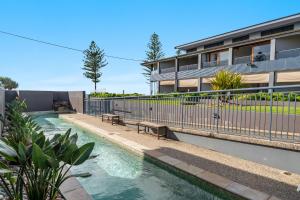 a swimming pool in the backyard of a house at Sea Breeze - Lennox Head in Lennox Head