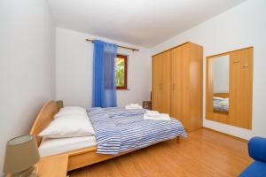 Posteľ alebo postele v izbe v ubytovaní Apartments Marina Veskovic