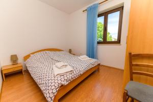 Posteľ alebo postele v izbe v ubytovaní Apartments Marina Veskovic
