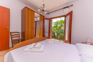 Posteľ alebo postele v izbe v ubytovaní Apartments Marina Veskovic