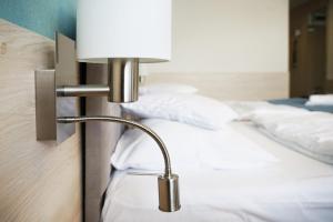 Posteľ alebo postele v izbe v ubytovaní Apartamenty Nad Parsętą Szpitalna 7
