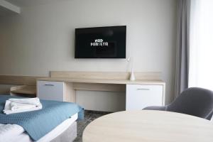 Televízia a/alebo spoločenská miestnosť v ubytovaní Apartamenty Nad Parsętą Szpitalna 7