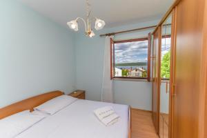 Posteľ alebo postele v izbe v ubytovaní Apartments Marina Veskovic