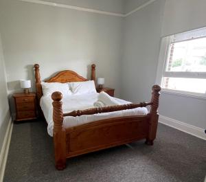 A bed or beds in a room at Old Sergeants Quarters